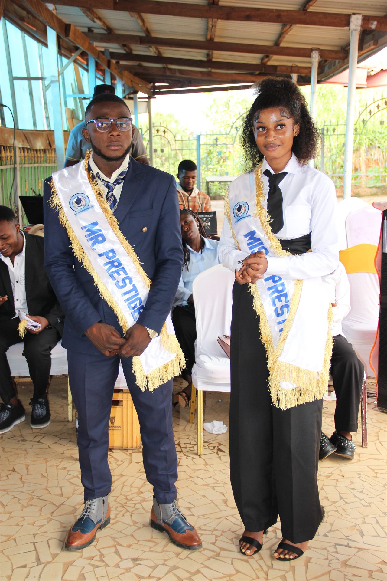 Mr and Miss Prestige crowned winners with sashes on stage